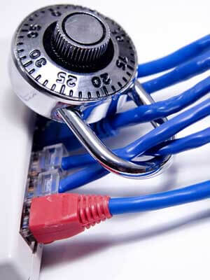 Photo of a combination lock around computer cables