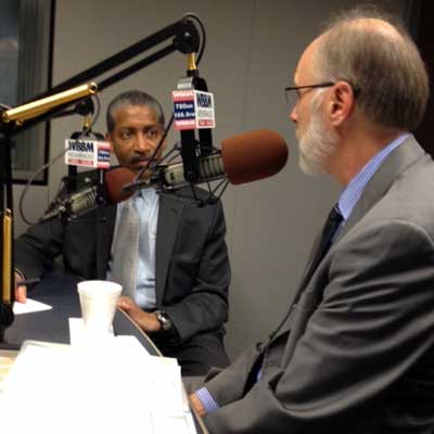 NIU President Doug Baker tapes an interview Friday with Craig Dellimore, political editor of WBBM-AM radio.