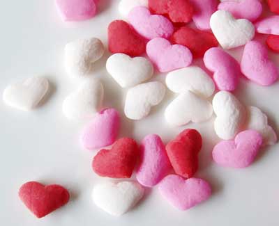 A photo of red, pink and white candy hearts