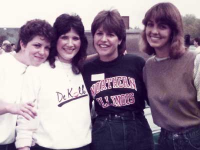 Karen Joens Johnson (second from right) attends an NIU tailgate in October of 1984.