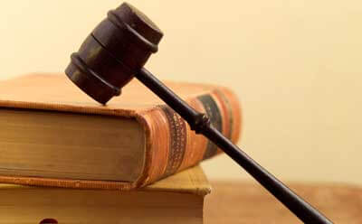 Photo of a gavel resting on law books