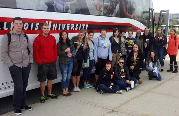 Students in a Fall 2013 TLC prepare to board the bus.