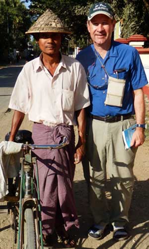 Clymer poses with a pedicab driver in Sittwe during a short trip to Rakhine State in Burma.