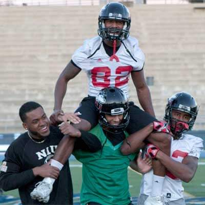 Ware rides the shoulders of his teammates during a Poinsettia Bowl practice.