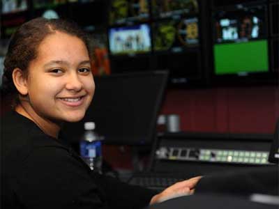 Sycamore High School freshman Emani Brinkman works Feb. 7 in the NIU Convocation Center video production control room.