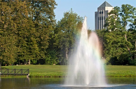 Photo of the East Lagoon fountain with the Holmes Student Center in the background
