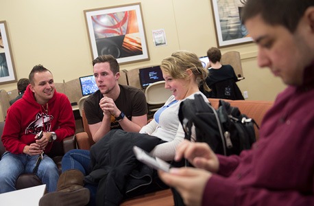 NIU students in a residence hall lobby area
