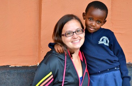 New NIU alumna Lucia Hoffman and Caren, a pre-school student who lives at the Amka Afrika hostel.