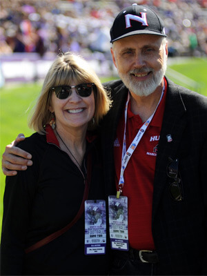 President Doug Baker and Dana Stover attend the NIU football game at Northwestern.