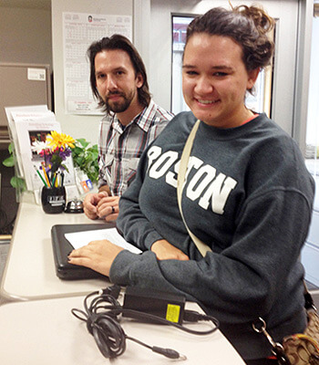 Maddie Gatz, a junior rehabilitation services major, received help at the DoIT Contact Center from Matthew Leman, DoIT computer analyst and technician.