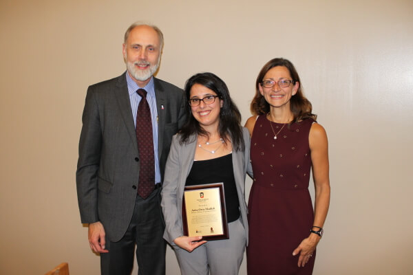 Anita Maddali, Associate Clinical Professor/Director of Clinics was recognized with a plaque for her passion and vision for the new Health Advocacy Clinic.  She is pictured with NIU President Doug Baker and Dean Jennifer Rosato Perea.