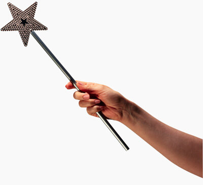 Photo of a hand holding a magic wand