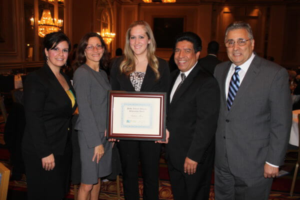 Pictured from left: Barbara N. Flores, DSF Scholarship Committee; Dean Jennifer Rosato Perea; second-year law student Rikkilee Moser; Hon. Jesse G. Reyes, DSF President; and Hon. William Haddad (ret.). 