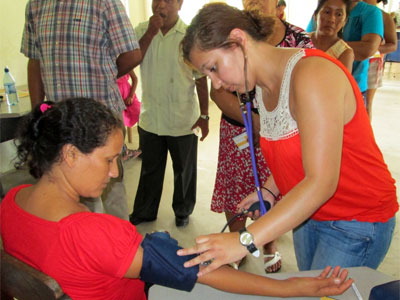 Samantha Garbacz volunteers in a small village in Belize, providing free blood pressure checks and glucose checks as well as giving information to people without access to health care on how they can live healthy lives.