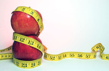 Photo of apples in measuring tape