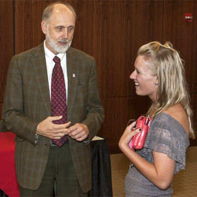 President Baker chats with a student Sept. 5, 2014, after the signing of a reverse-transfer agreement with the College of Lake County.