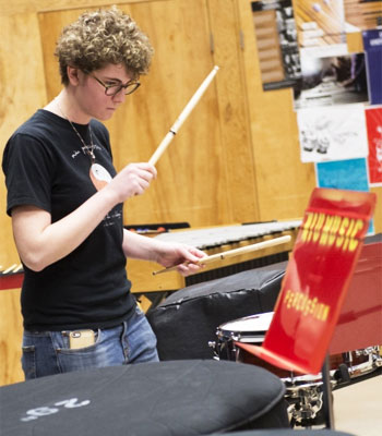 An NIU student plays the snare drum.