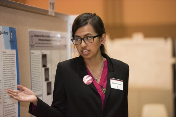 Erin Hernandez explains her research at the 2015 Undergraduate Research and Artistry Day.