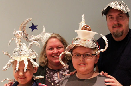 Visitors worked with SMARTspace@NIU coordinator Mary Baker to create tinfoil hats to protect their brains from Martian transmissions.