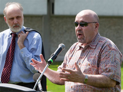 NIU President Doug Baker (left) and DeKalb Mayor John Rey lead the groundbreaking ceremony for the Communiversity Gardens.