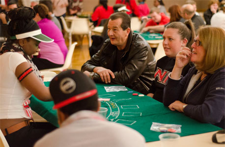 An NIU family enjoys Casino Night during the 2014 Fall Family Weekend.