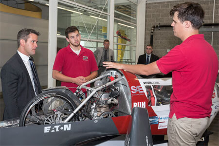 U.S. Congressman Adam Kinzinger, R-Channahon, chats Thursday with members of NIU’s highly successful Supermileage Team.