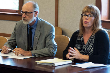 NIU President Doug Baker and Kristen Meyer, chair of the VAWA Implementation Committee