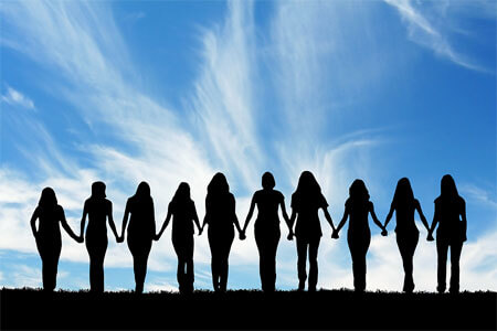 A photo of women in silhouette holding hands