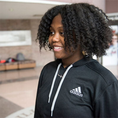 An NIU student in the Campus Life Building