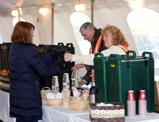 Volunteers handed out coffee, hot chocolate and other concessions to fans in the Spirit Zone tent during the inaugural year of IHSA Destination DeKalb in 2013.