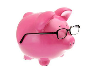 Photo of a piggy bank with glasses