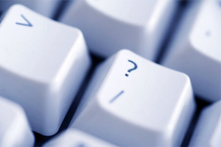 The question-mark key on a computer keyboard