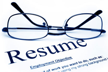 A pair of glasses on a resume