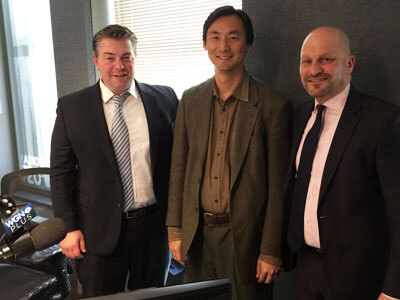 WGN “Legal Face-Off” hosts Jason Whiteside (left) and NIU Law alumnus Rich Lenkov ('95, right) host NIU Law Professor Morse Tan (center) to discuss his new book on North Korea.